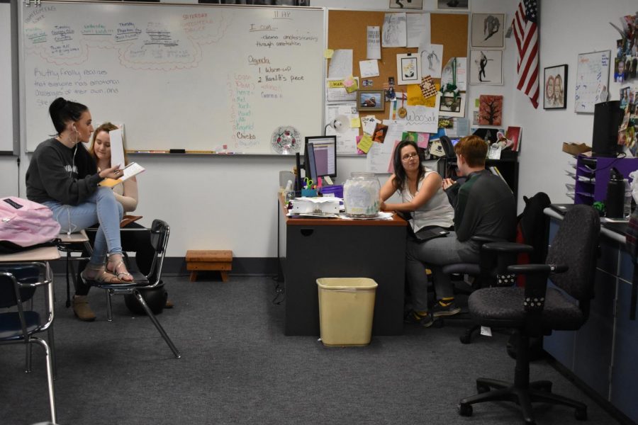A-West English teacher Angela Dryer talks with students. 