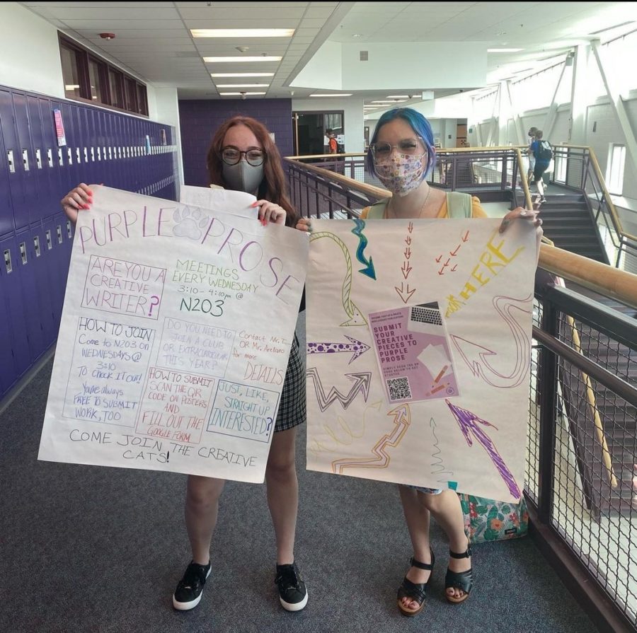 Purple Prose editors Haylee Griffith (left) and Destiny Edgett (right) advertise for Purple Prose. 
