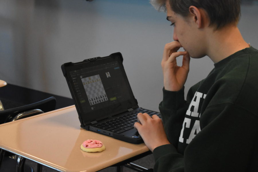 Sophomore Shane Alley eats a sugar-filled cookie during his first period.