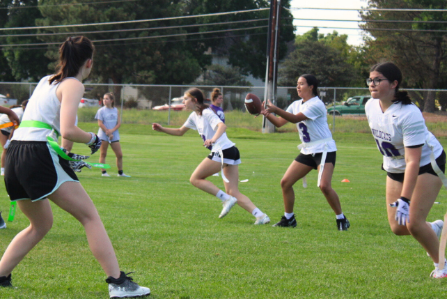  The juniors varsity girls flag football team scrimmages during practice.