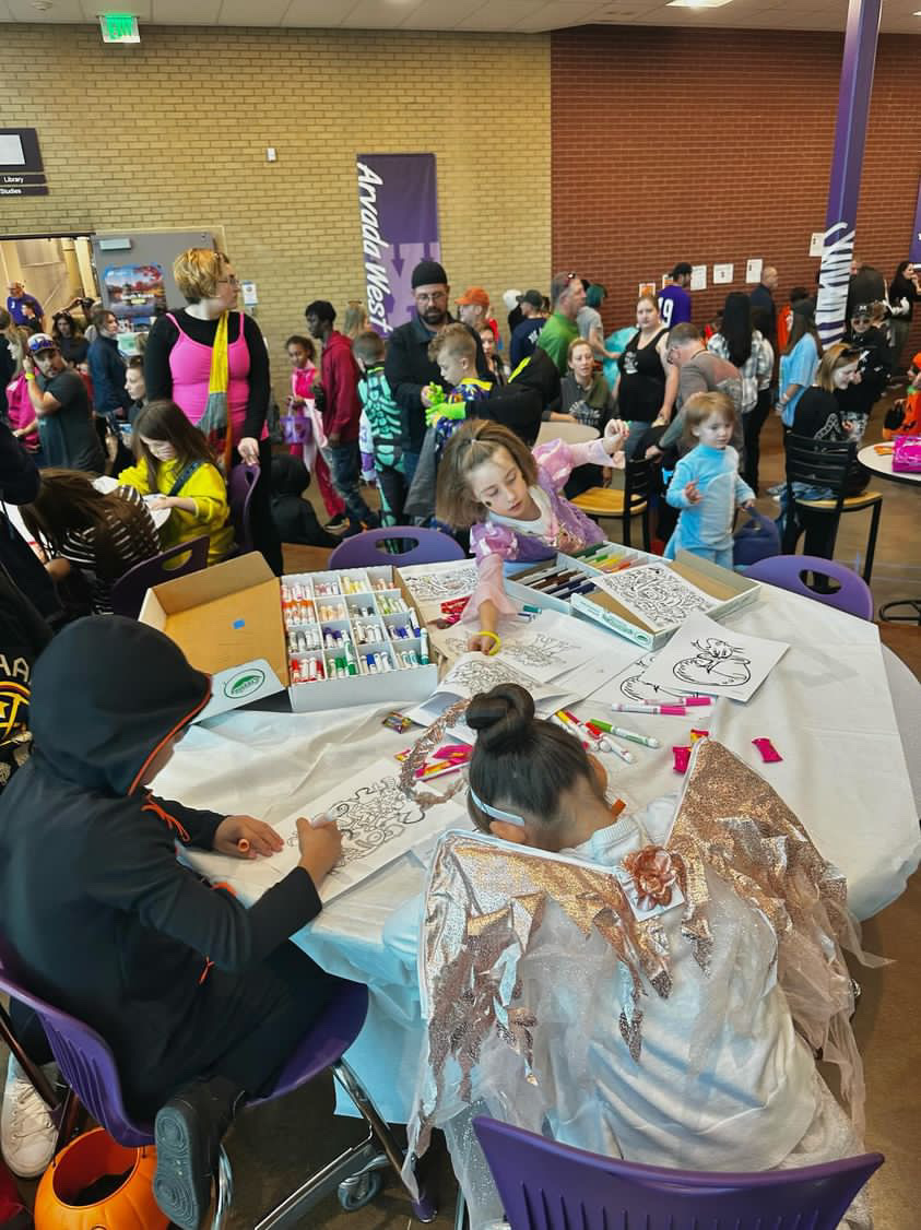 Children color in the commons during Trick or Treat Street