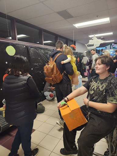 STEAM Club is involved around the school, pictured above running a station during Arvada West's annual Trick or Treat Street in October (Photo contributed by Chloe Sherman)